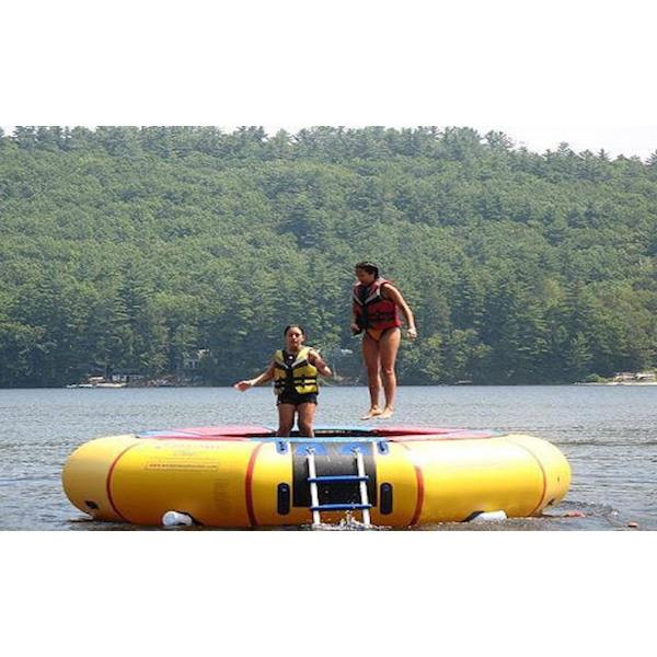 Island Hopper 15ft Classic Water Trampoline on the lake with 2 girls jumping on the yellow water trampoline.