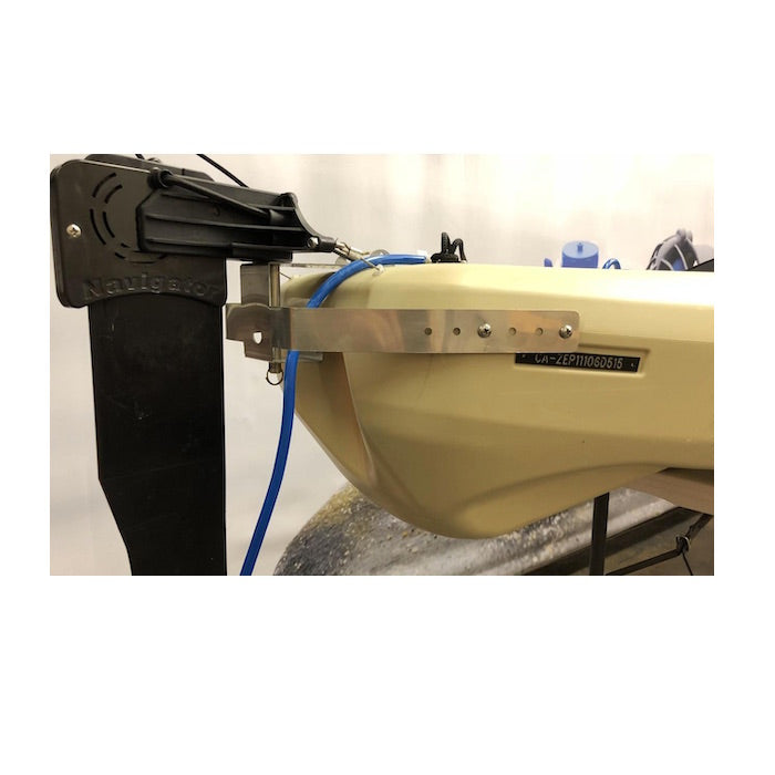 Bixpy WillFit Gudgeon attached to a tan kayak and universal rudder adapter side view.