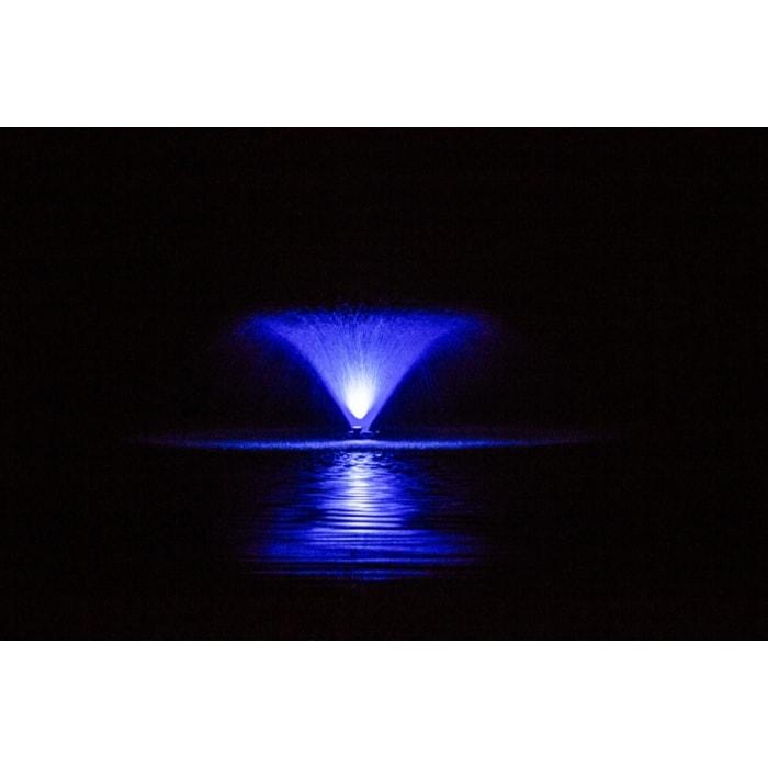Bearon Aquatics  F1000F 115v-230v 1 Hp Aerating Fountain being lit up by a blue Light Kit on a pitch black night, reflection can be seen off the water.