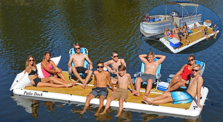 How an Inflatable Dock can Enhance Your Summer Fun at The Lake. Images shows 10 people sitting on an Inflatable Dock with chairs, loungers, and coolers. There is a subset image of an inflatable dock for a pontoon boat.