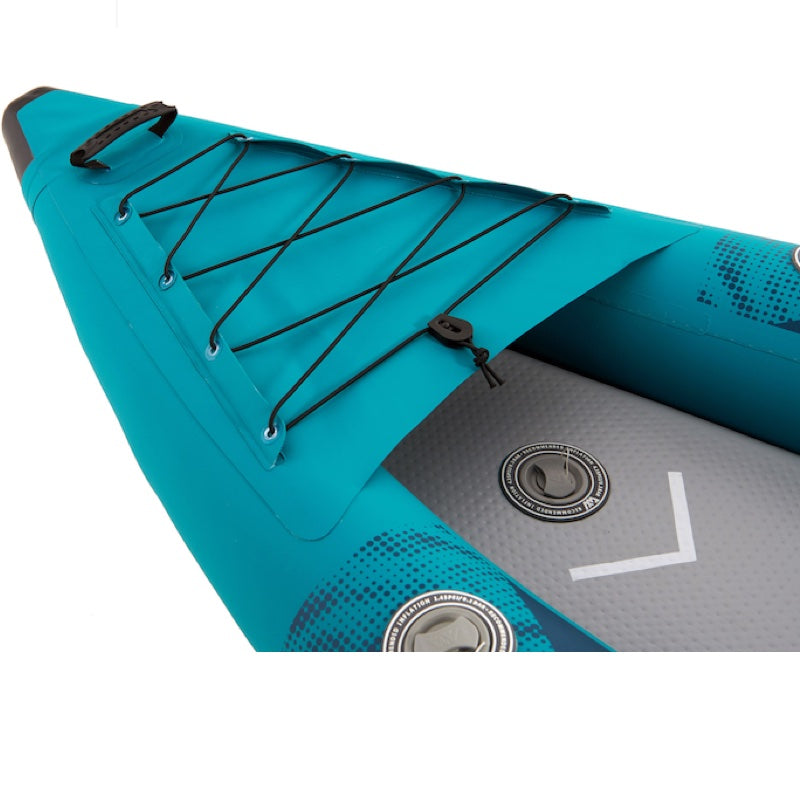 Close-up of a teal inflatable kayak with black bungee ropes on a white background