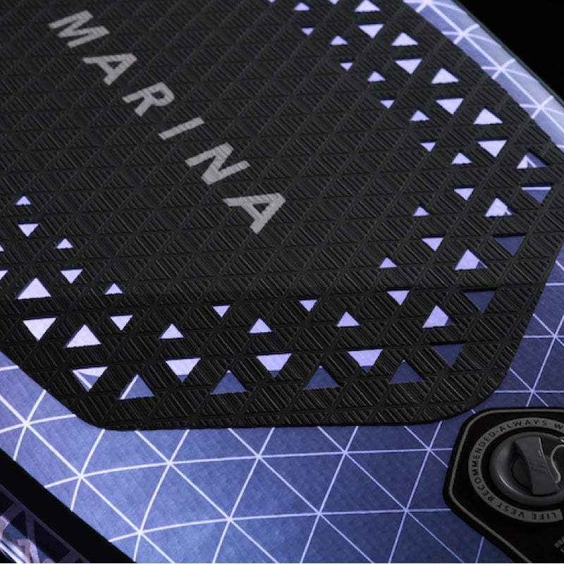 Black textured mat with 'MARINA' branding on a blue grid background