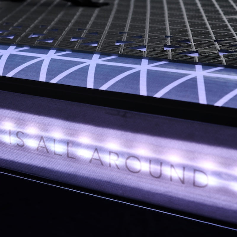 Close-up of an inflatable paddleboard with text on the neck