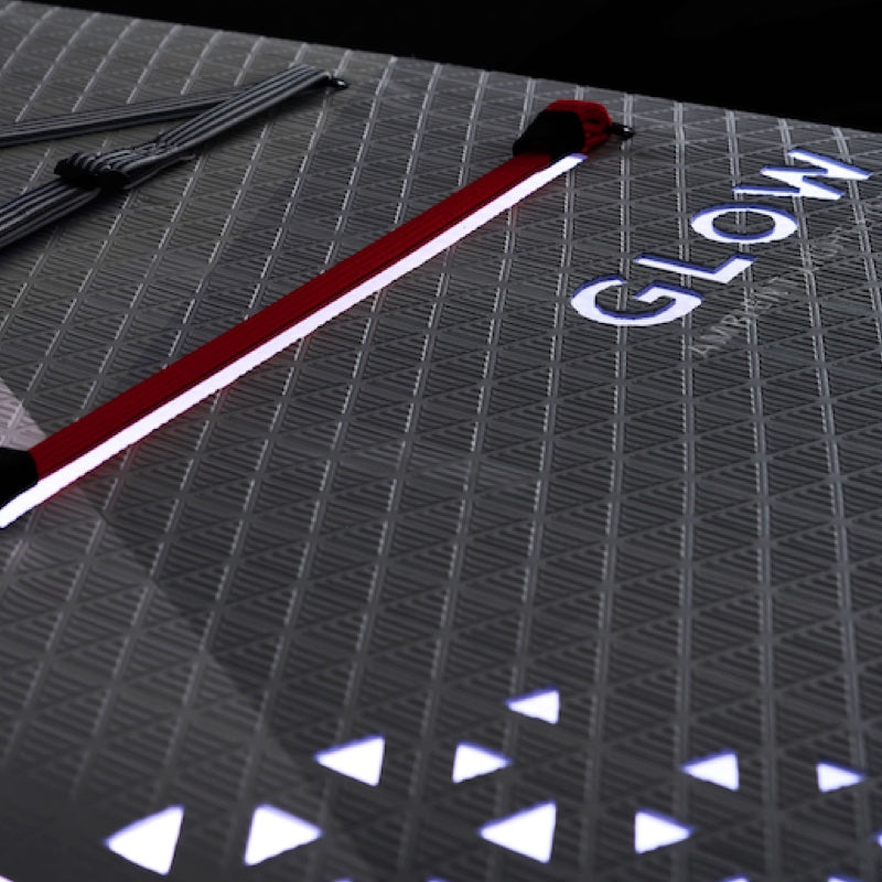 Glowstick on a textured surface with 'GLOW' branding.