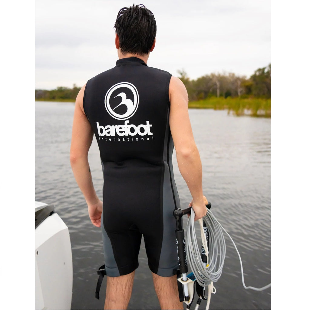 back view of the Barefoot sleeveless wetsuit. Black and grey with big white logo on the back.