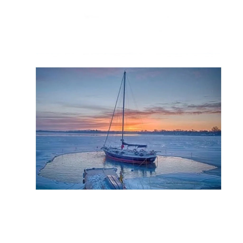 Bearon Aquatics P250 Ice Eater - 1/4 Hp carved out a huge amount of ice around the small sailboat, near the port, in the middle of a frozen lake.