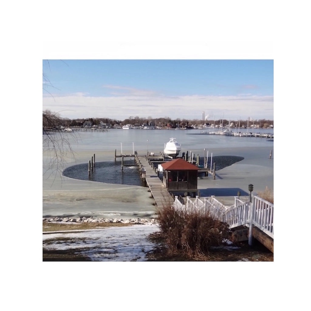 Bearon Aquatics P1000 Ice Eater - 1 Hp at work from a distance that carved out parts of the frozen water around the port.