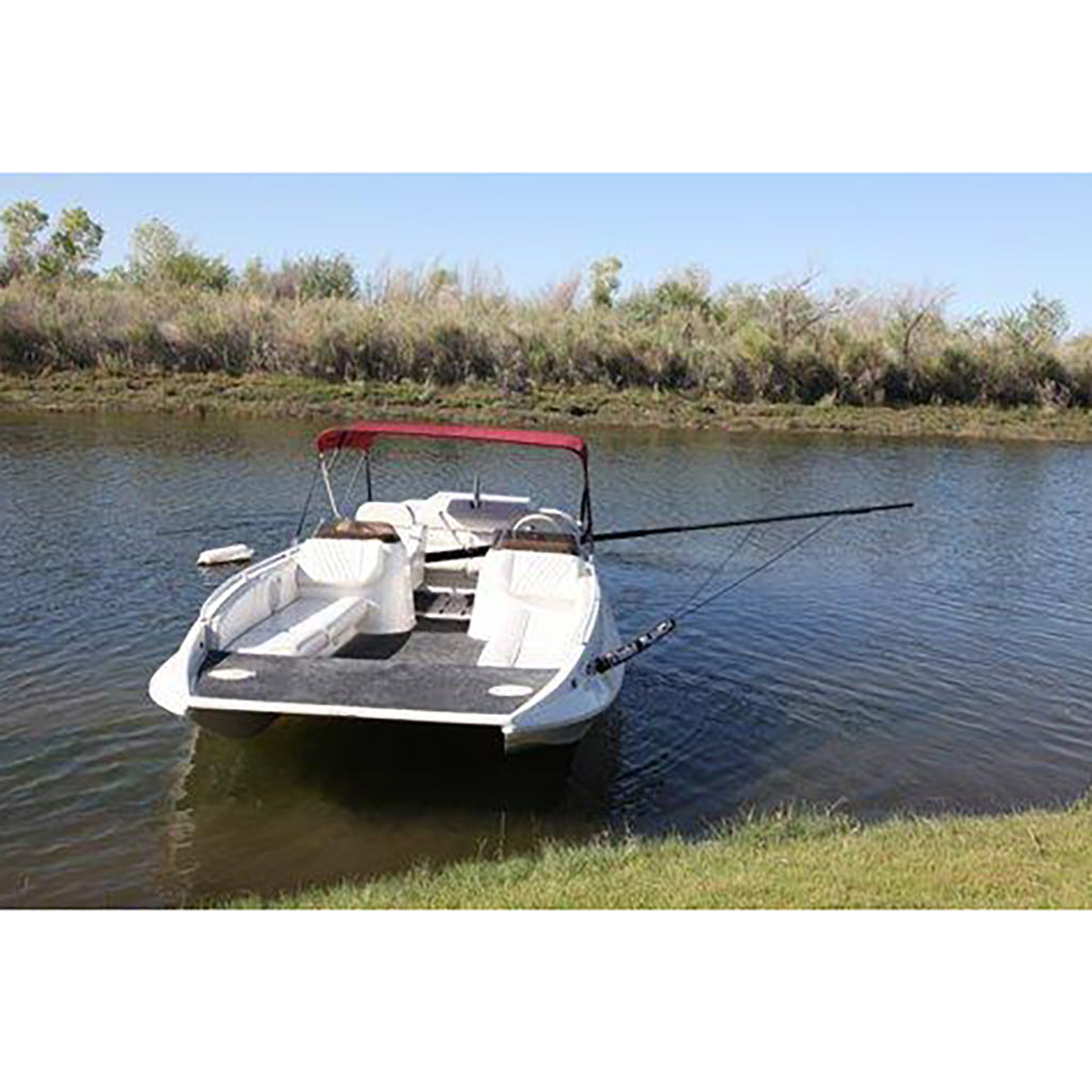 This is an image of the Barefoot Fly High Deluxe Boom installed to the right side of a white Jet boat on a lakeside.