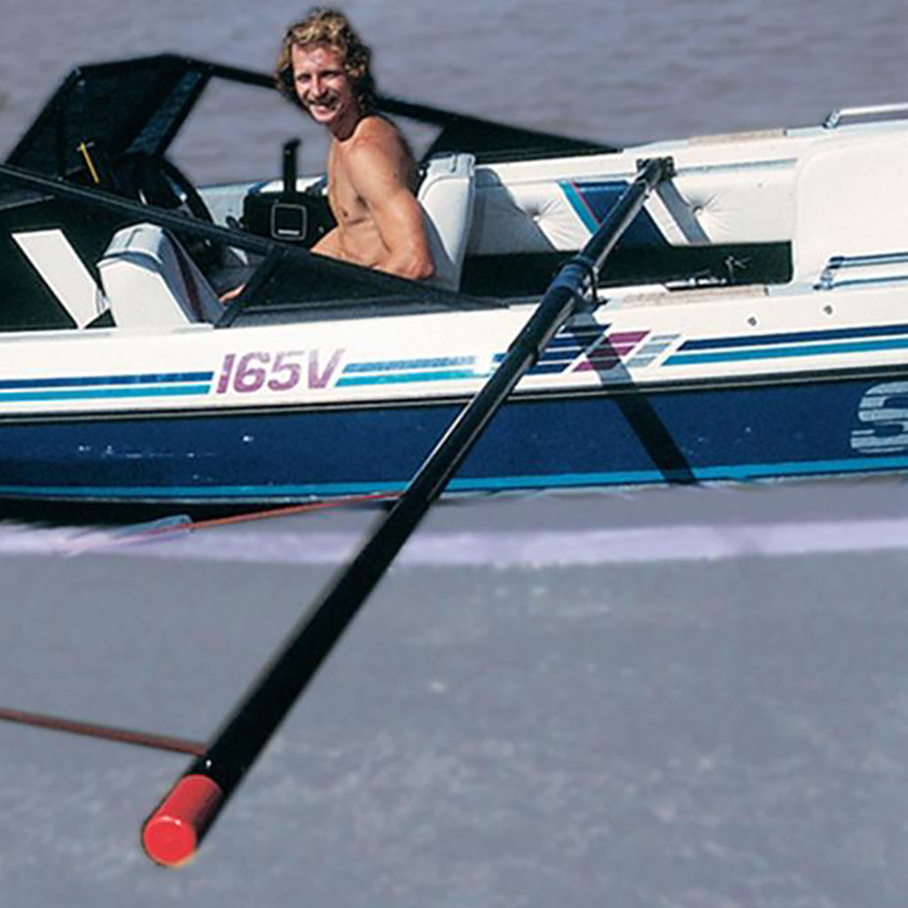 This is an image of the Barefoot Fly High Deluxe Gunnel Mount Boom installed on the Jet Boat with a man onboard.