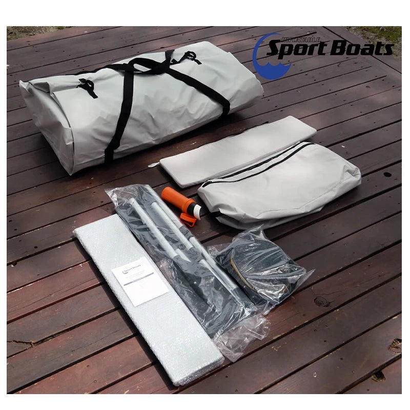 Inflatable Sport Boats included product itmes on a wooden surface