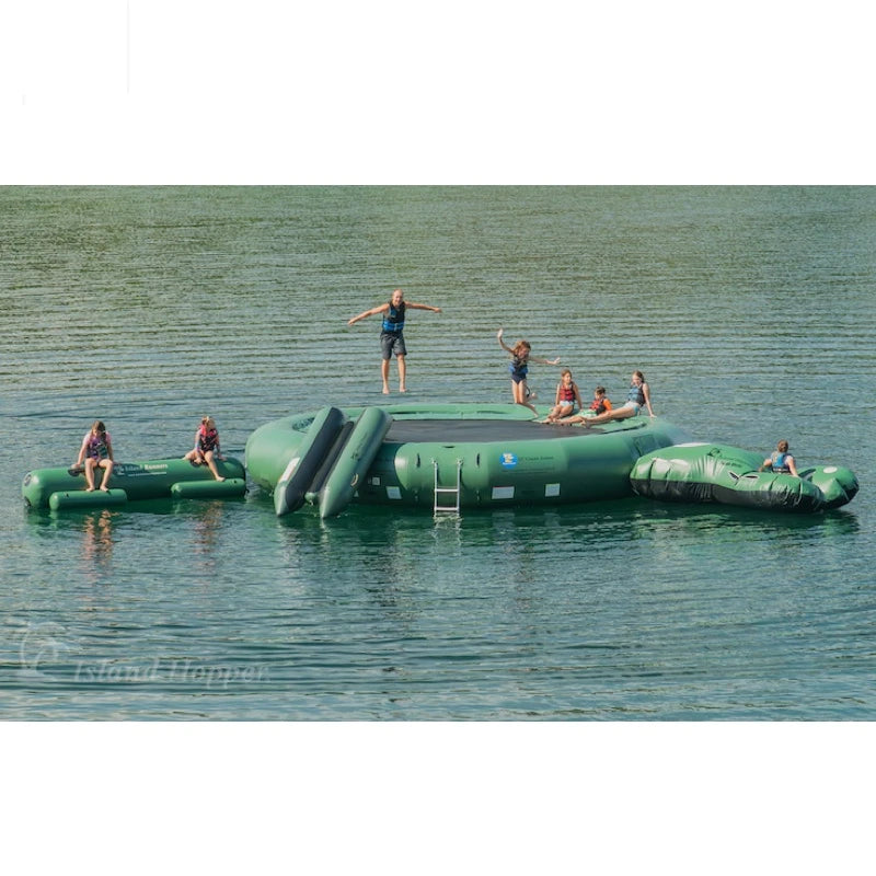 Green Inflatable water trampoline with people on a lake