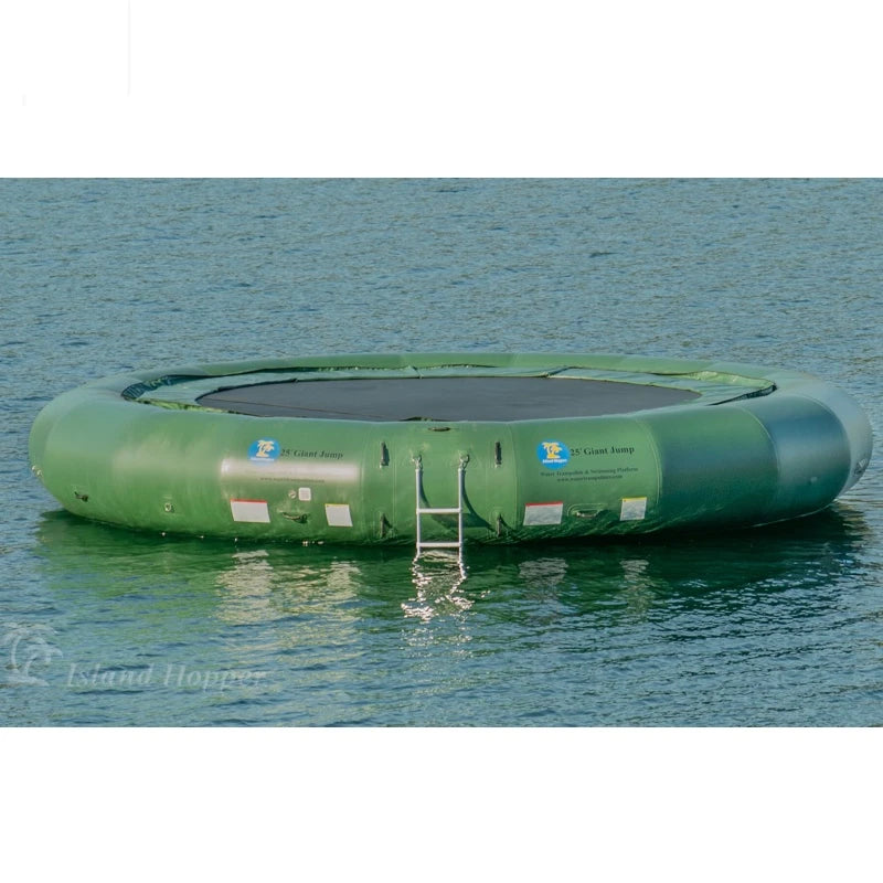 Green inflatable trampoline floating on water with a ladder