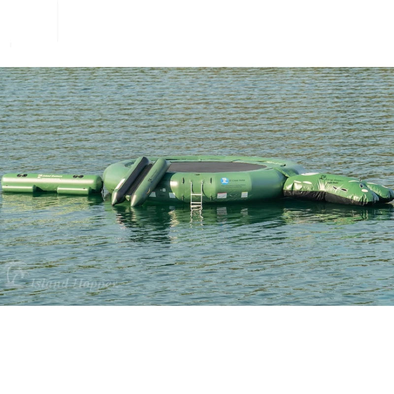 Inflatable green trampoline floating on water with a ladder.