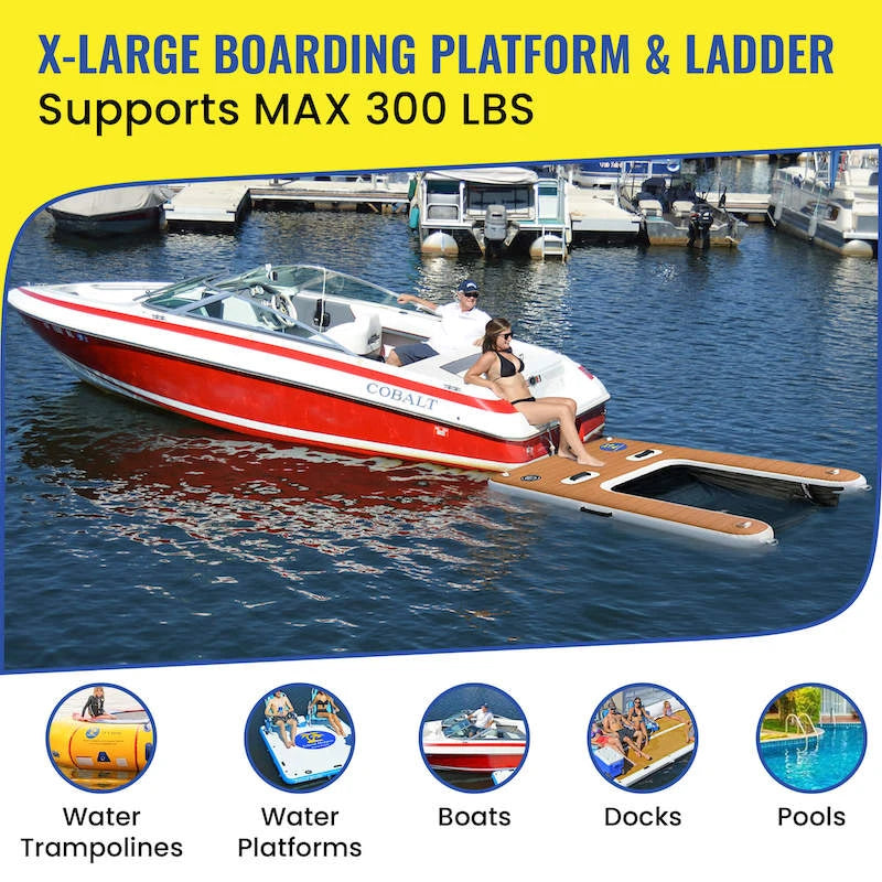 Red and white boat with an extended boarding platform and ladder on a body of water.