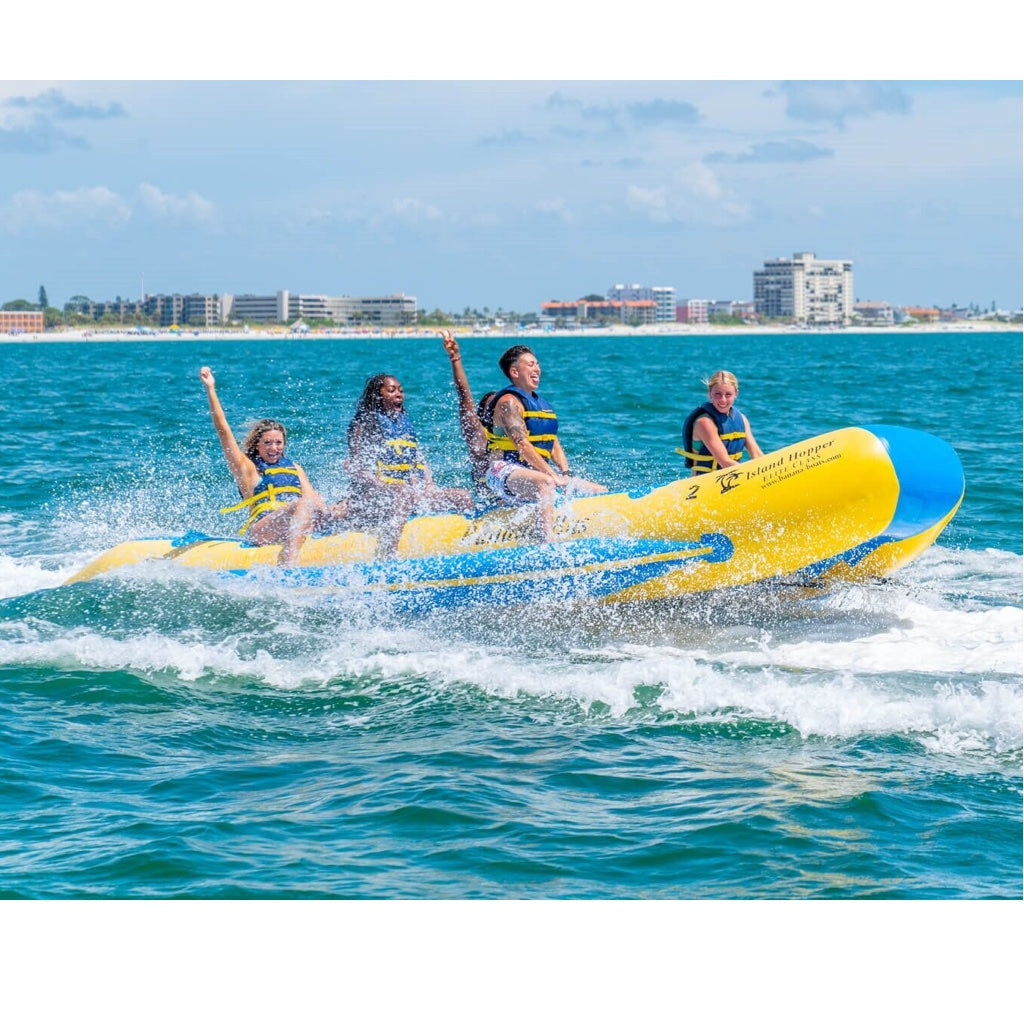 Island Hopper 14 Person Banana Boat Tube out on the ocean with 6 passenders.