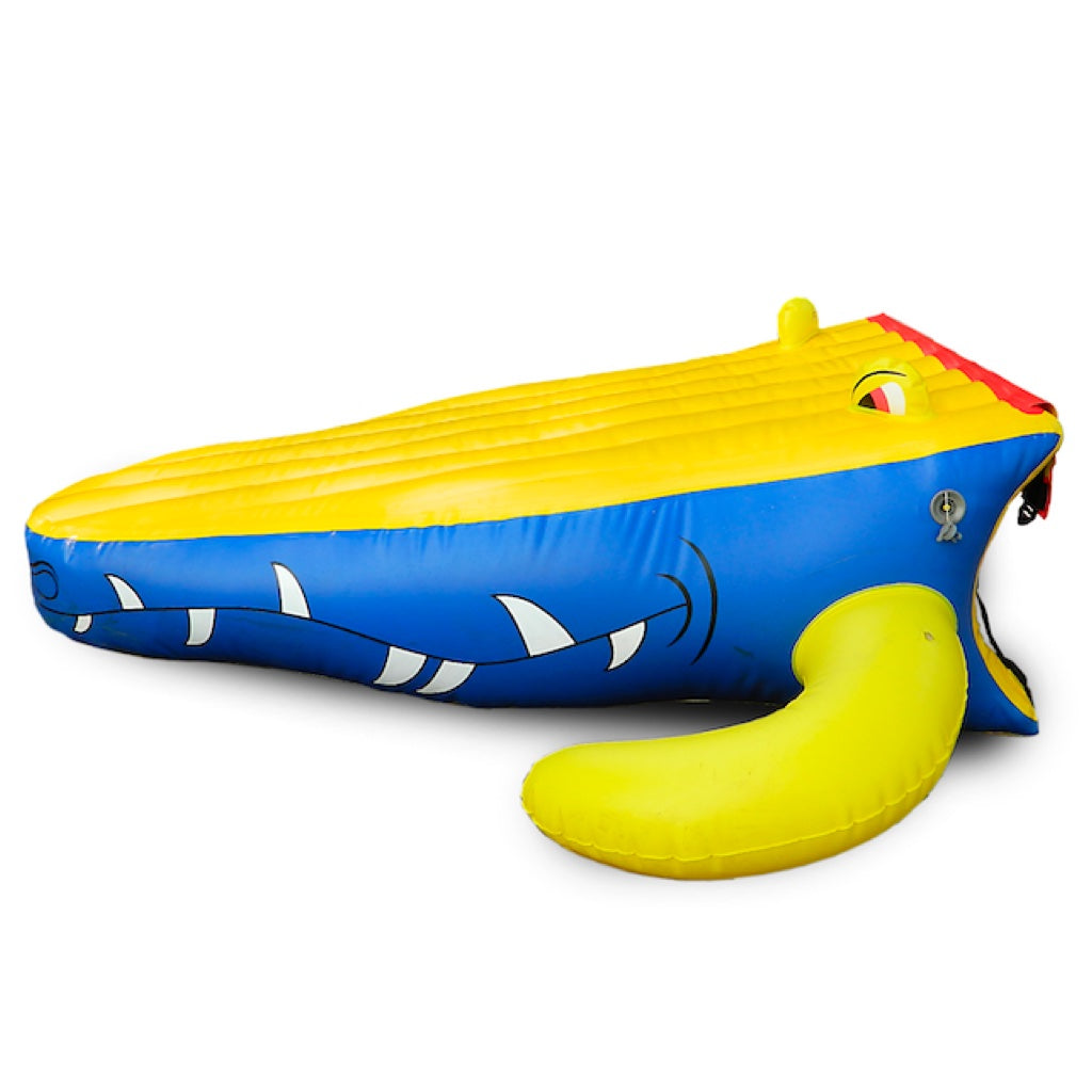 The Island Hopper Gator Monster Head Water Trampoline and Water Bounce Attachment. Yellow on top of the slide, blue on the side with gator teeth.