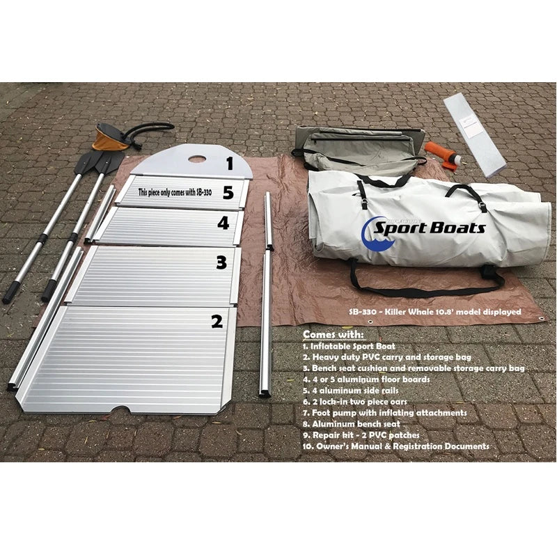 Manta Ray Inflatable boat kit with aluminum floor and components on a paved surface