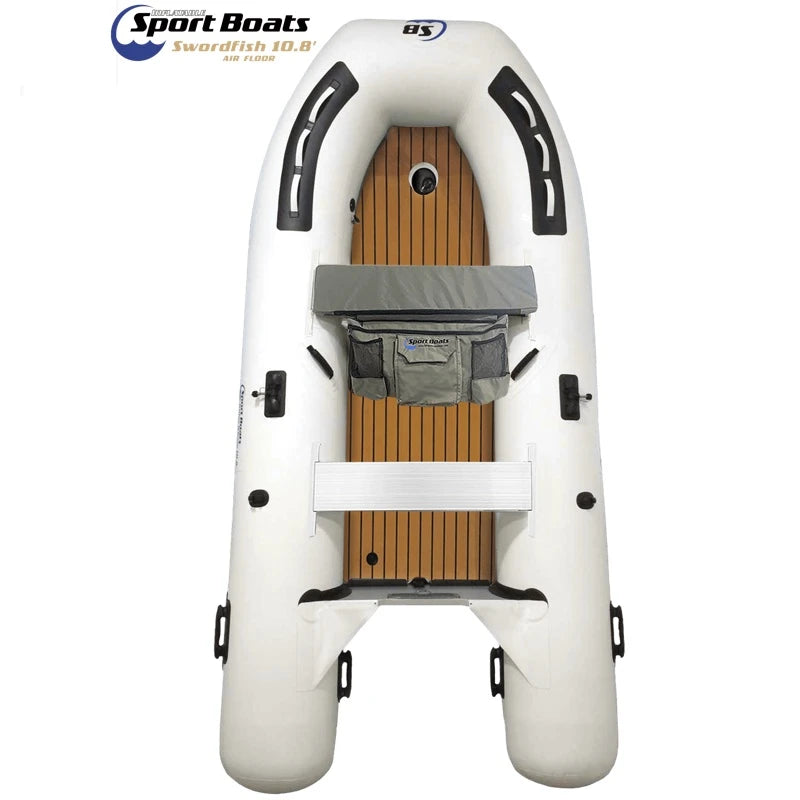 Inflatable boat with teak deaking and white exterior on a white background