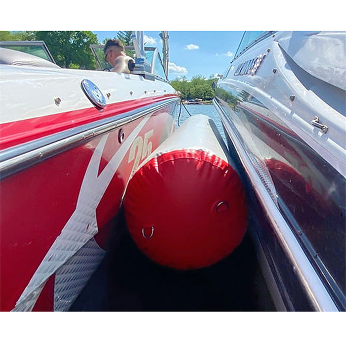 This is the Paradisepad Inflatable Bumper in between two docked boats on the water.