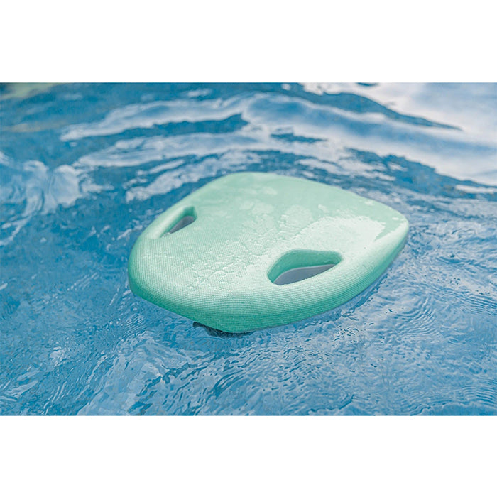 This is the green Asiwo Mako Electric Kickboard floating on the pool water.