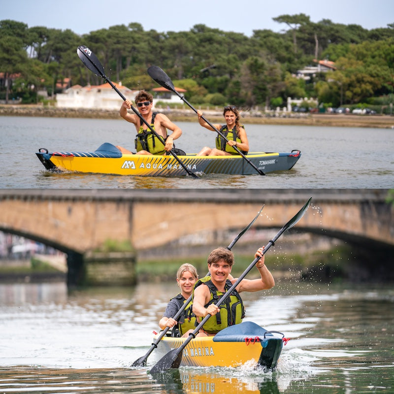 Two inflatable Tomahawk kayaks with people paddling on a body of water with a bridge in the background.