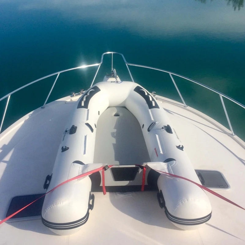 Inflatable lifeboat on a boat with clear blue water in the background