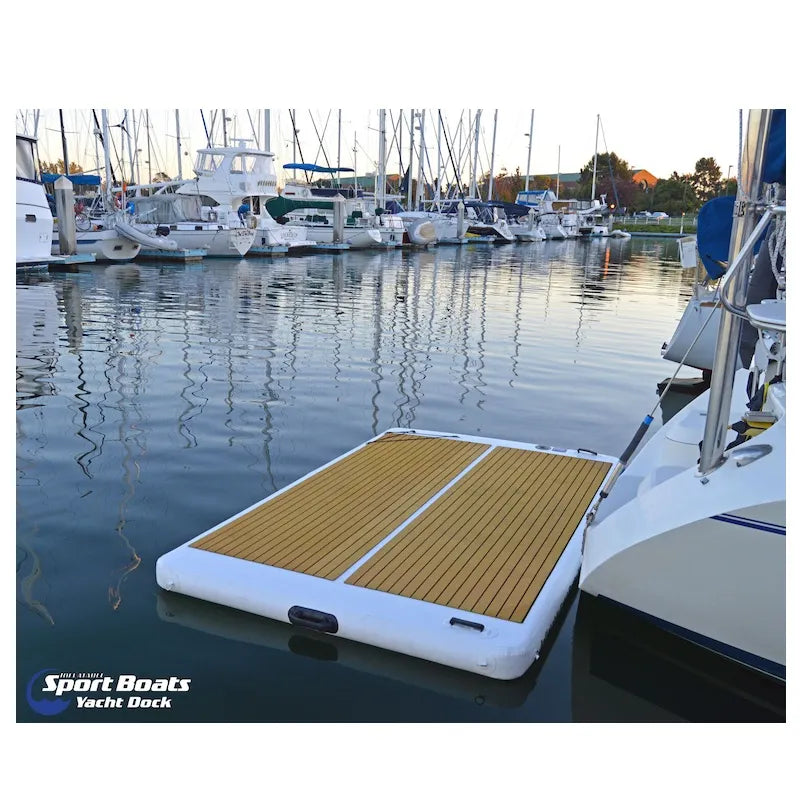 Inflatable dock on water with marina background
