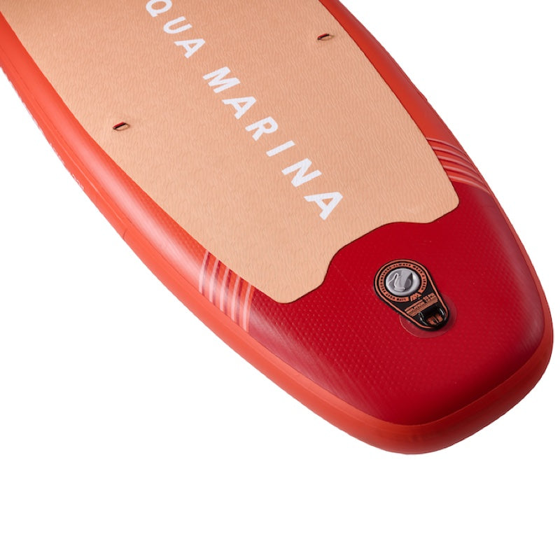 Red inflatable paddle board with 'Aqua Marina' branding on a white background