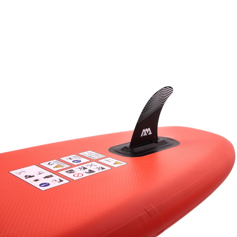 Red inflatable paddle board with a fin and instructions on a white background