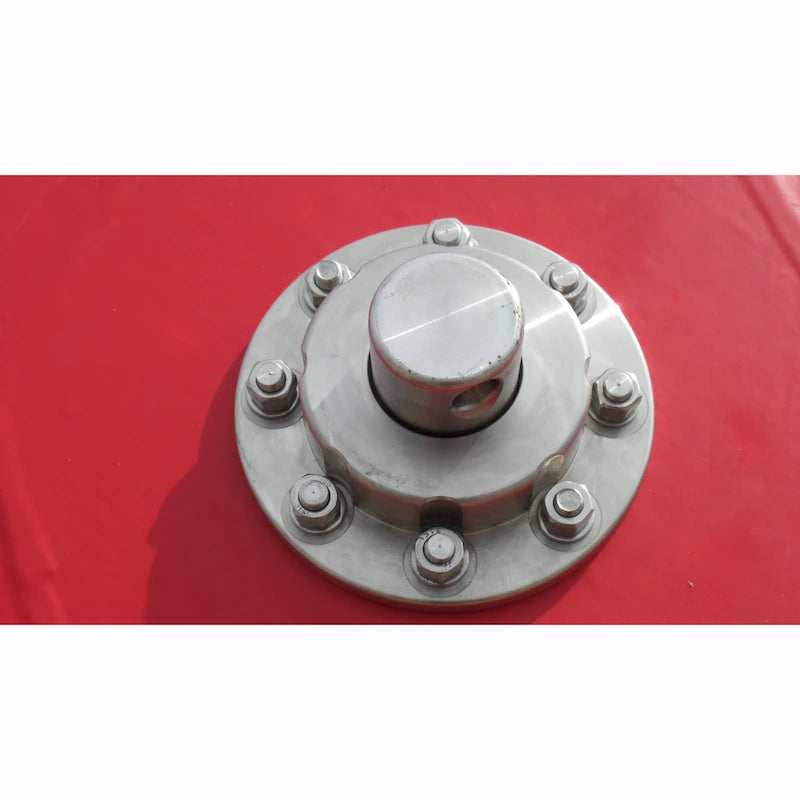 Metallic wheel hub on a red background