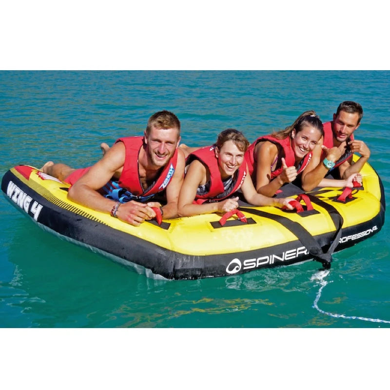 Four people on a yellow and black inflatable tube in the water, with 'Spinera' branding.