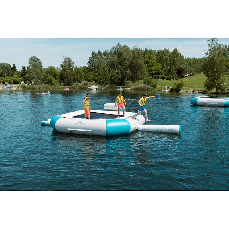 Inflatable water bouncer on a lake with people around