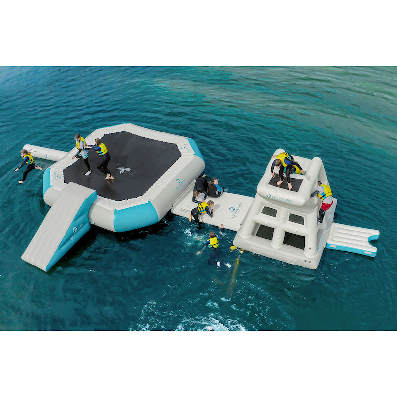 Two inflatable platforms in the water with people on them