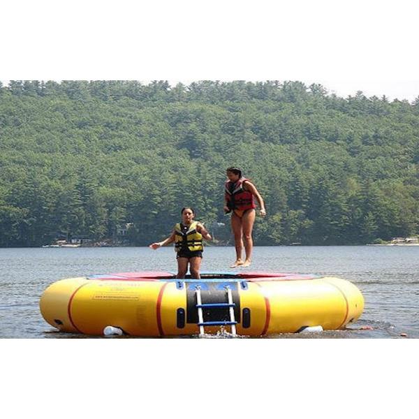 Island Hopper 15ft Classic Water Trampoline on the lake with 2 girls jumping on the yellow water trampoline. 