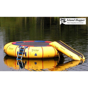 Yellow Island Hopper 20 Acrobat Water Trampoline setup in the water with Bounce N Slide water attachment.