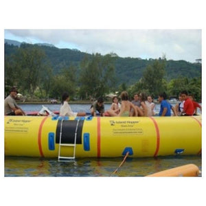 Close up view of several kids sitting on the Island Hopper 20 Acrobat Water Trampoline on the water. 