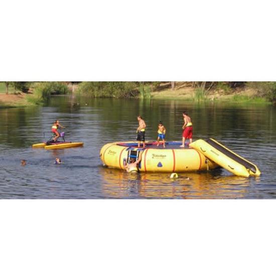 Kids playing on the Island Hopper 20ft Acrobat Water Trampoline in the lake.