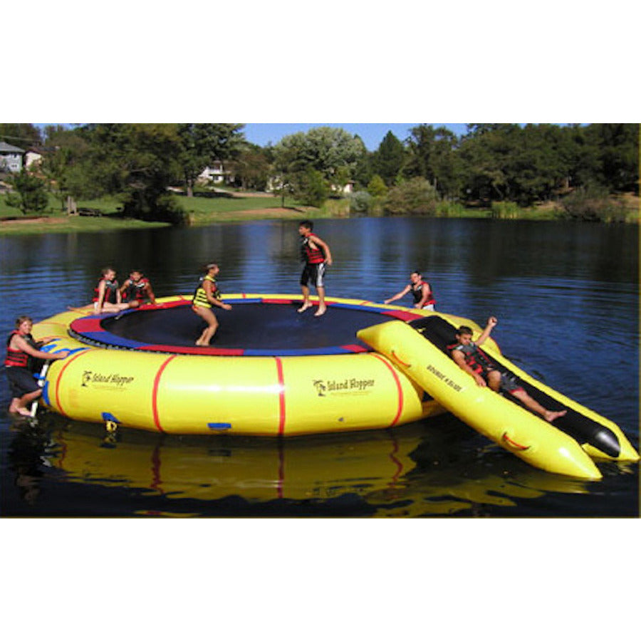 Island Hopper 25' Giant Jump Water Trampoline on the lake being played on by several young kids. 