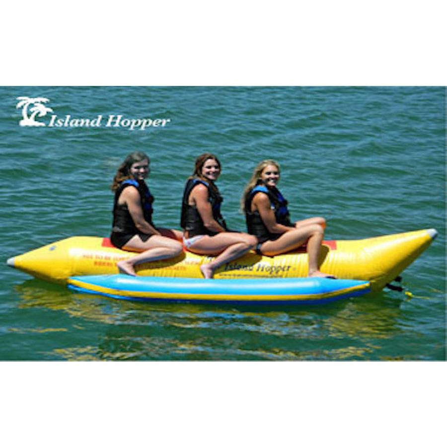 Island Hopper 3 Person Banana Boat Tube side view with 3 girls sitting on the 3 person banana boat on the lake. 