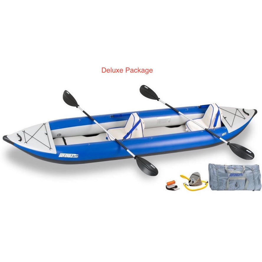 Sea Eagle Explorer 420X Tandem Inflatable Kayak Deluxe package top and side display view with the bag and pump sitting next to the Sea Eagle inflatable kayak. 