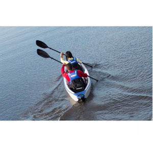 2 woman paddling a Sea Eagle RazorLite 473rl Tandem Inflatable Kayak through the water. 