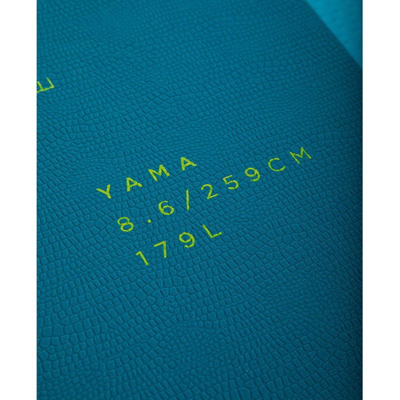 This is a close-up on the aquamarine body of the Yama SUP 8.6 where the model name and number are engraved in neon green.