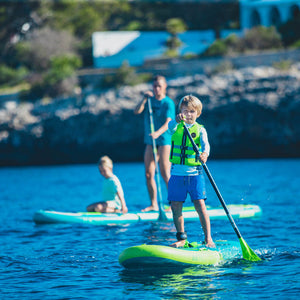 This is a photo of the Yama SUP 8.6 in action where a child roughly 8-10 years old is paddleboarding on the Yama SUP 8.6 in the lake.