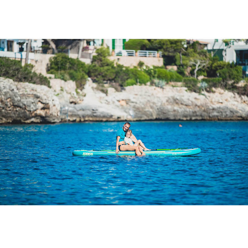 Loa 11.6 Inflatable Paddle Board in action on the water boarding a woman with a child on it.