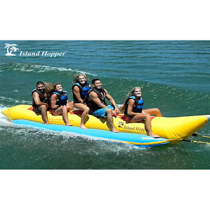 Side view of 5 kid riding the Island Hopper 5 Person Banana Boat Tube on the lake.