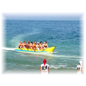 8 adults riding an Island Hopper 8 Person Towable Banana Boat Tube on the ocean.