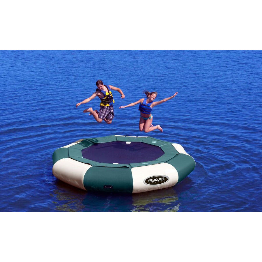 Green and Tan Rave Aqua Jump 120 Eclipse Northwoods Water Trampoline being jumped on by 2 kids on the lake. 