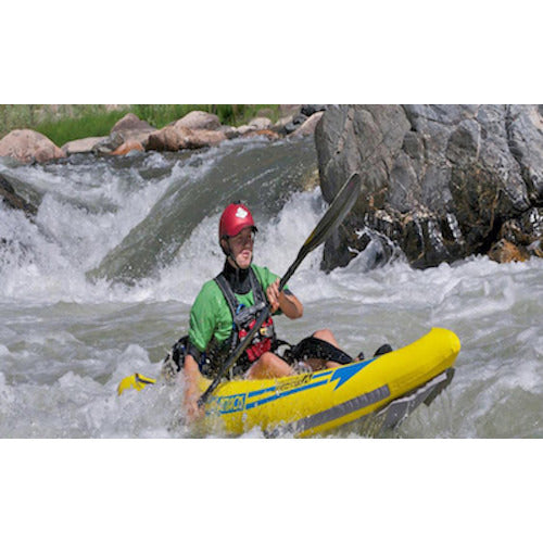 Front view of a kayaker paddling the yellow Advanced Elements Attack Whitewater 1 Person Inflatable Kayak