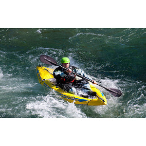 Yellow Advanced Elements Attack Whitewater 1 Person Inflatable Kayak coming off a wave with a single paddler. 