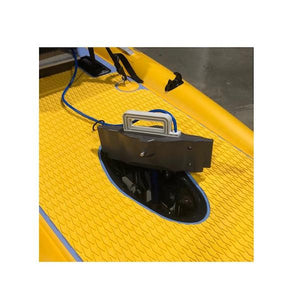 Bixpy Fin Pedal Drive Adapter for Kayaks partially inserted into opening in the yellow kayak floor.